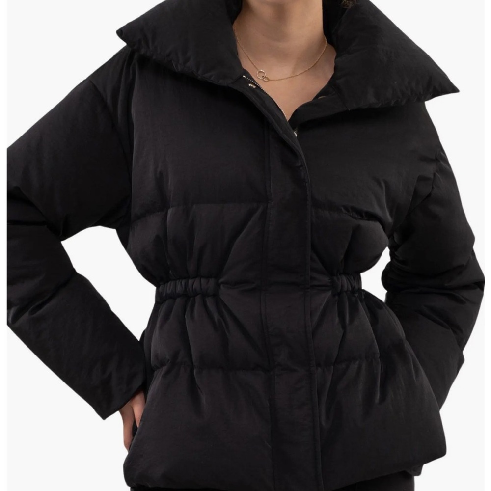 Black puffer jacket with cinched waist